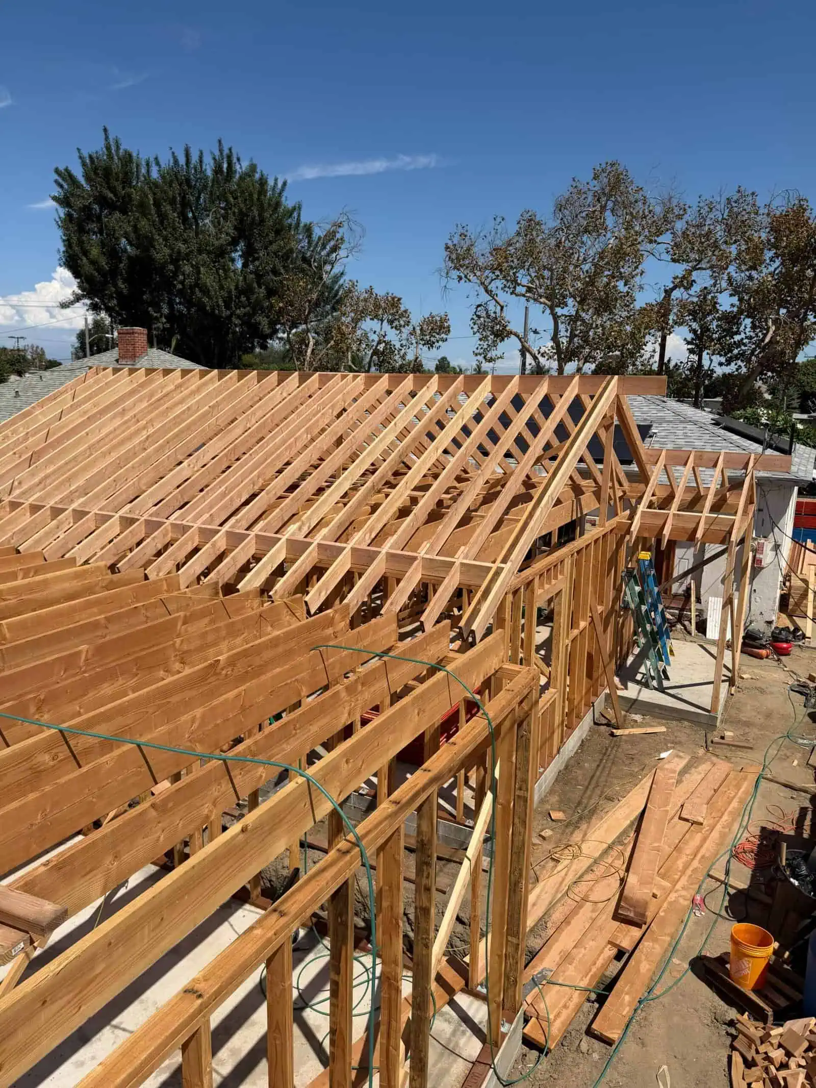 Roof framing under construction by D/J Construction Inc.